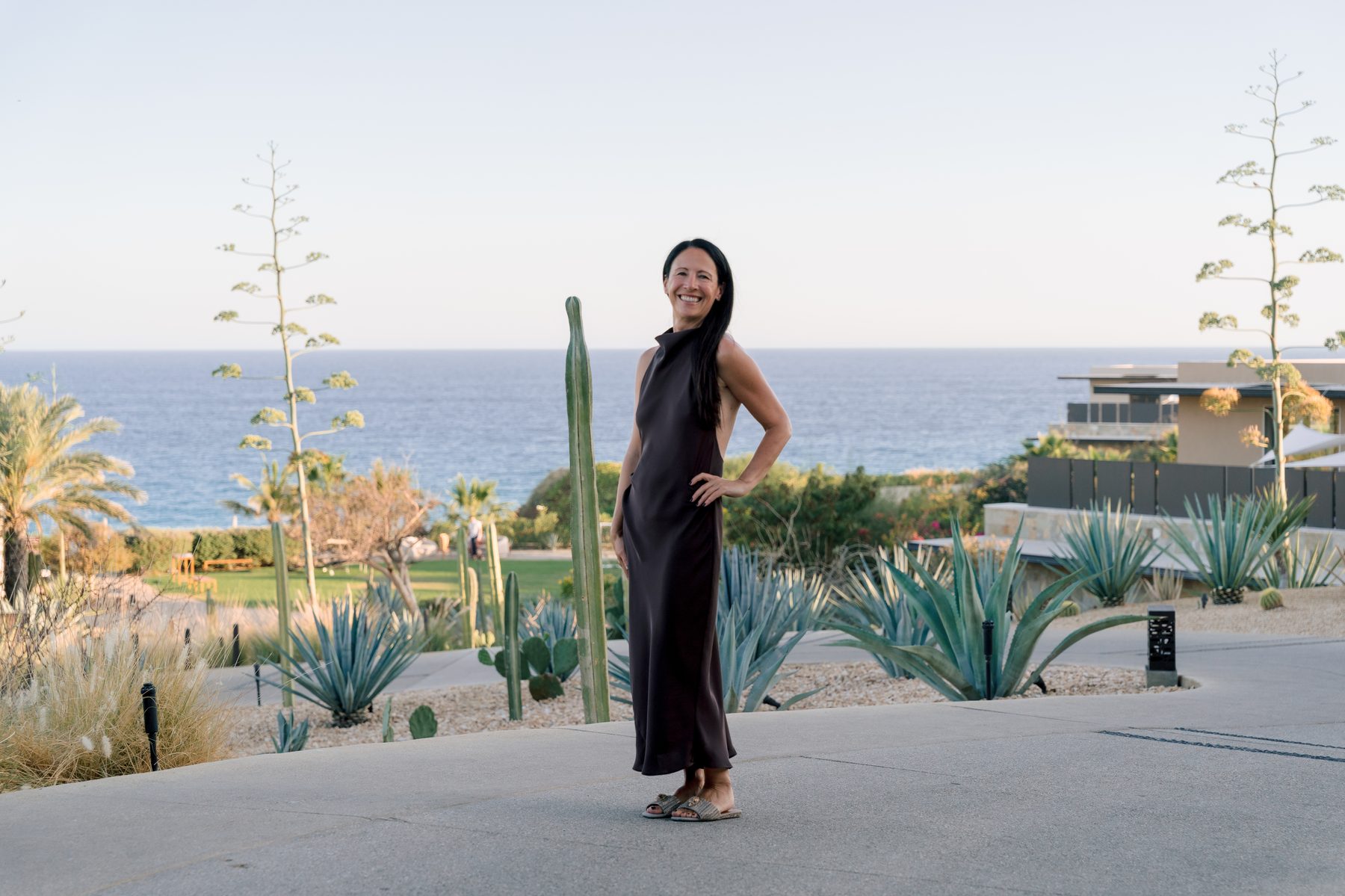 Lisa Axford standing above the coastline