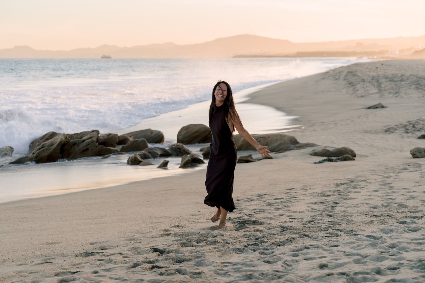 Lisa Axford laughing on the beach